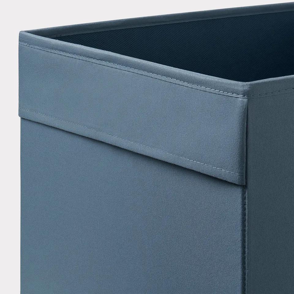 Close-up of teal DRÖNA storage box showing sturdy, recycled fabric with neat stitching and two handles.