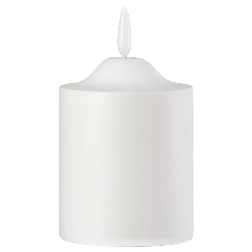 A white SMÅLOM led pillar candle. It is cylindrical with a smooth surface and a pointed top.