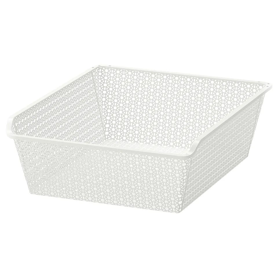 A white KOMPLEMENT metal mesh basket. Rectangular, it's designed for storing clothes and accessories. The sides have a perforated pattern for airflow.