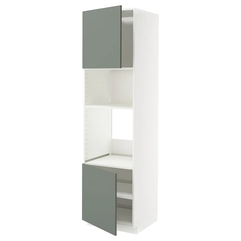 METOD kitchen units with light green doors and white shelves.