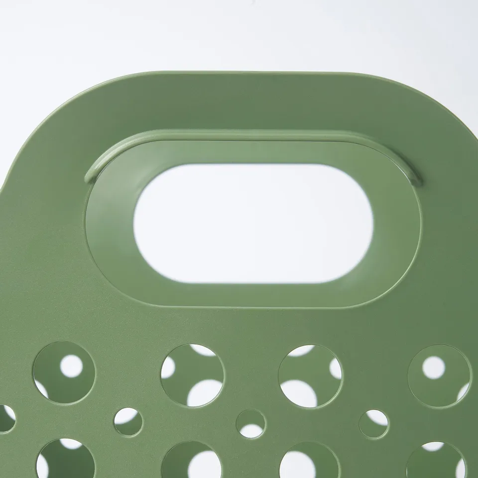 Green perforated laundry basket with handle, durable and breathable, perfect for cleaning clothes.
