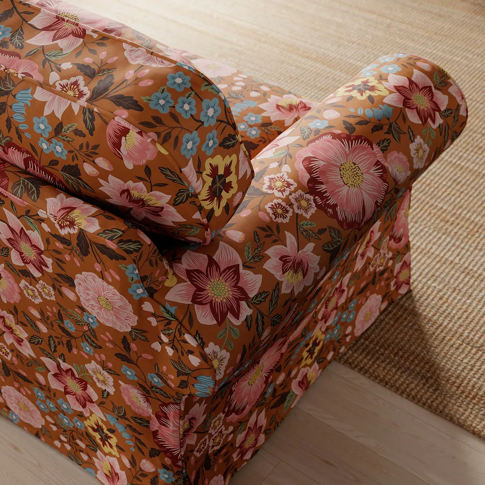 Intricate floral chair detail with dark green leaves, high-quality fabric.