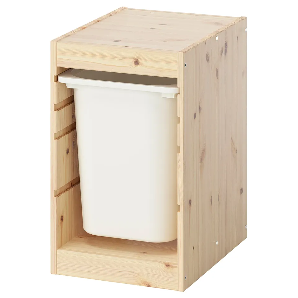 An ikea TROFAST storage unit, light wood, rectangular with open front, holding a white plastic bin.