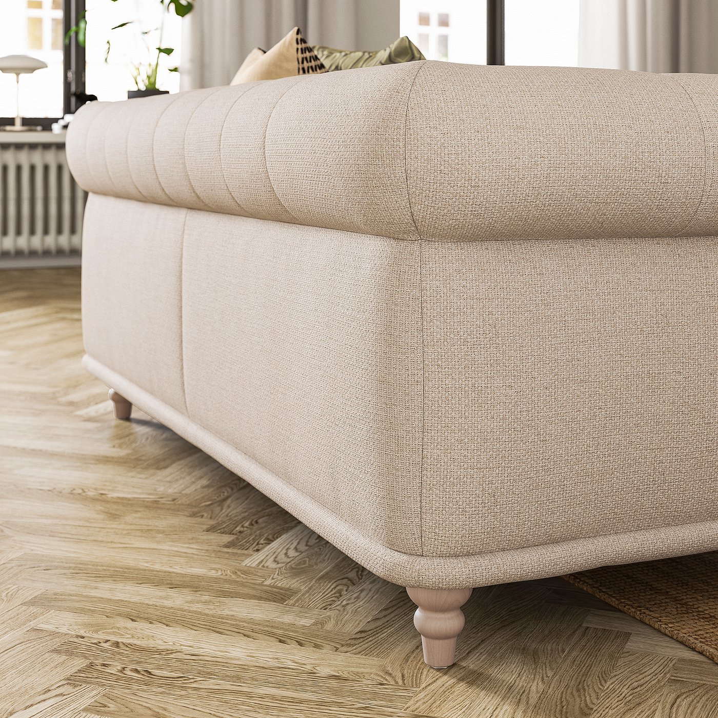 A beige VISKAFORS sofa in a cosy room. Its rounded shape and soft upholstery invite comfort.