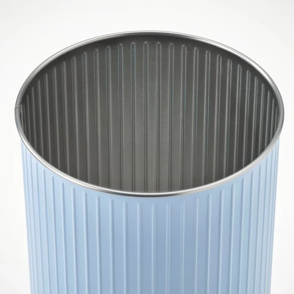 Light blue fluted metal tin with smooth edges, high quality finish, ideal for storage.