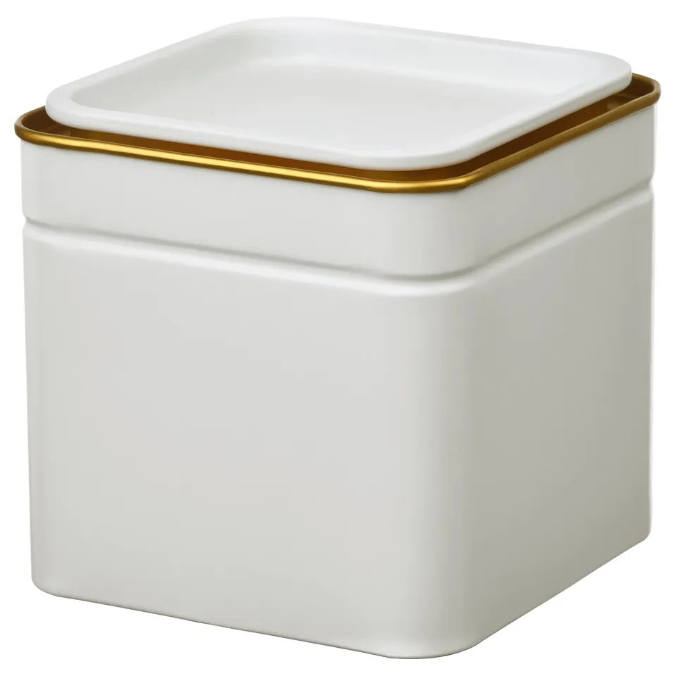 White square bin with gold trim.