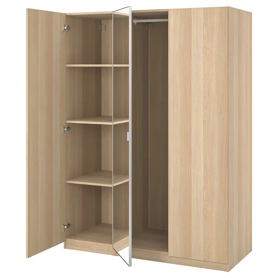 Light wood PAX wardrobe, open showing shelves, hanging rod, and soft close doors.
