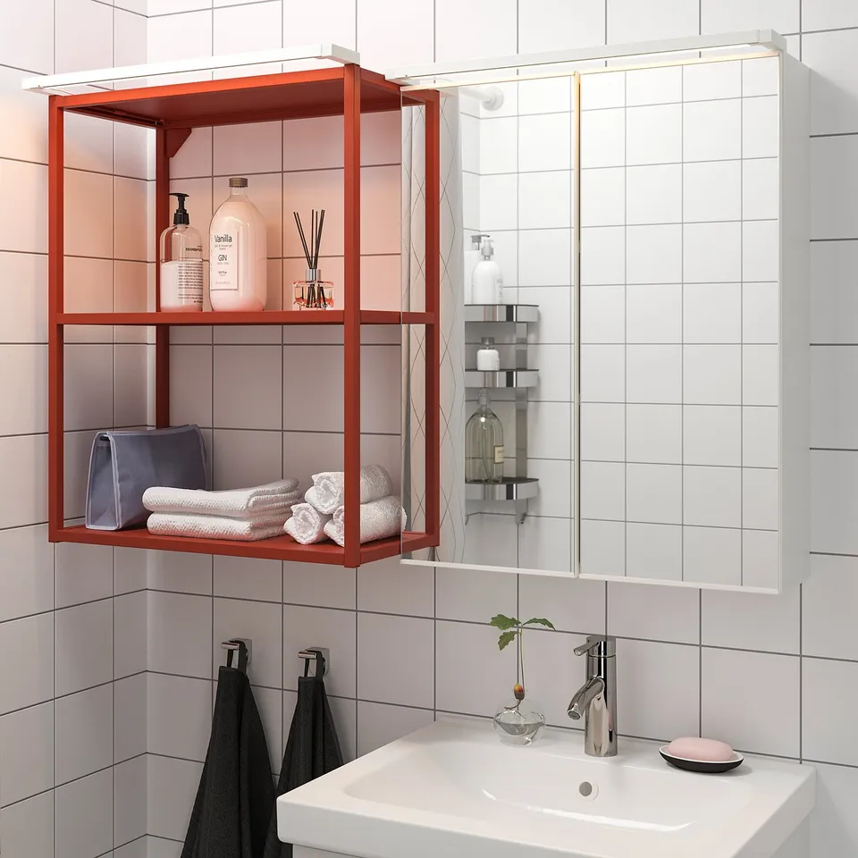 Led-lit bathroom sink & toiletries.