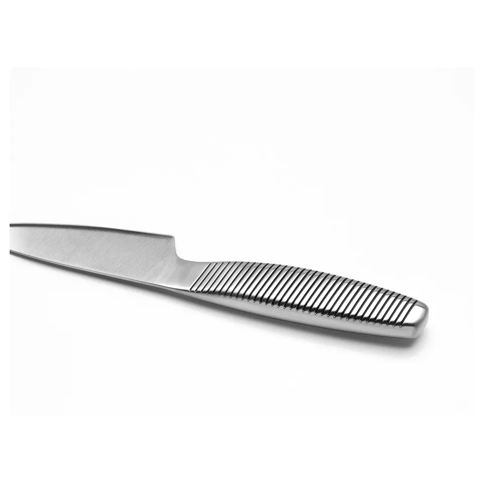 Metal knife with ridged handle. Sharp blade; robust quality. Stainless steel construction.