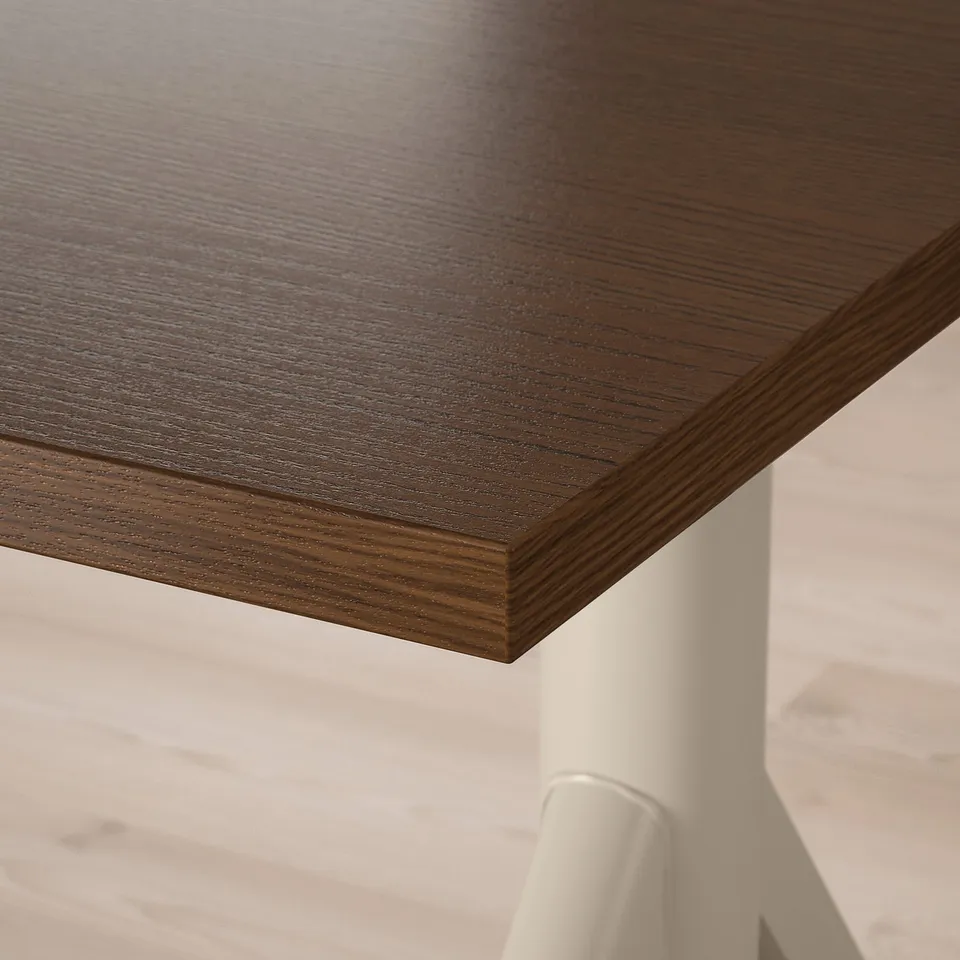 Dark wooden desk with polished grain and smooth edging.