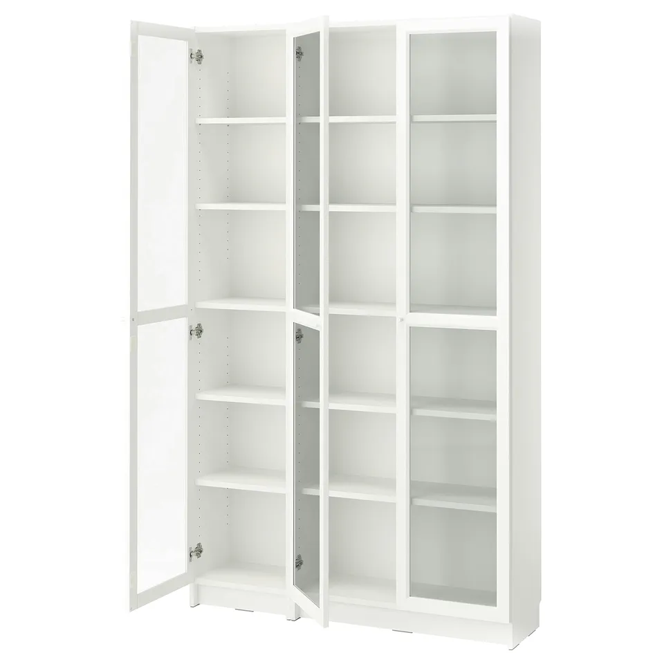 A white BILLY bookcase with glass doors. It adjustable shelves and a sleek design.