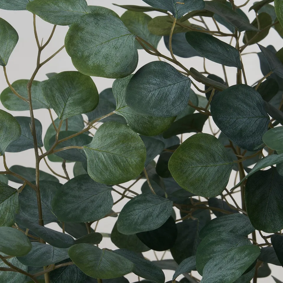 Vibrant artificial plant with realistic, dark green leaves and sturdy stems, visually appealing and well-made.