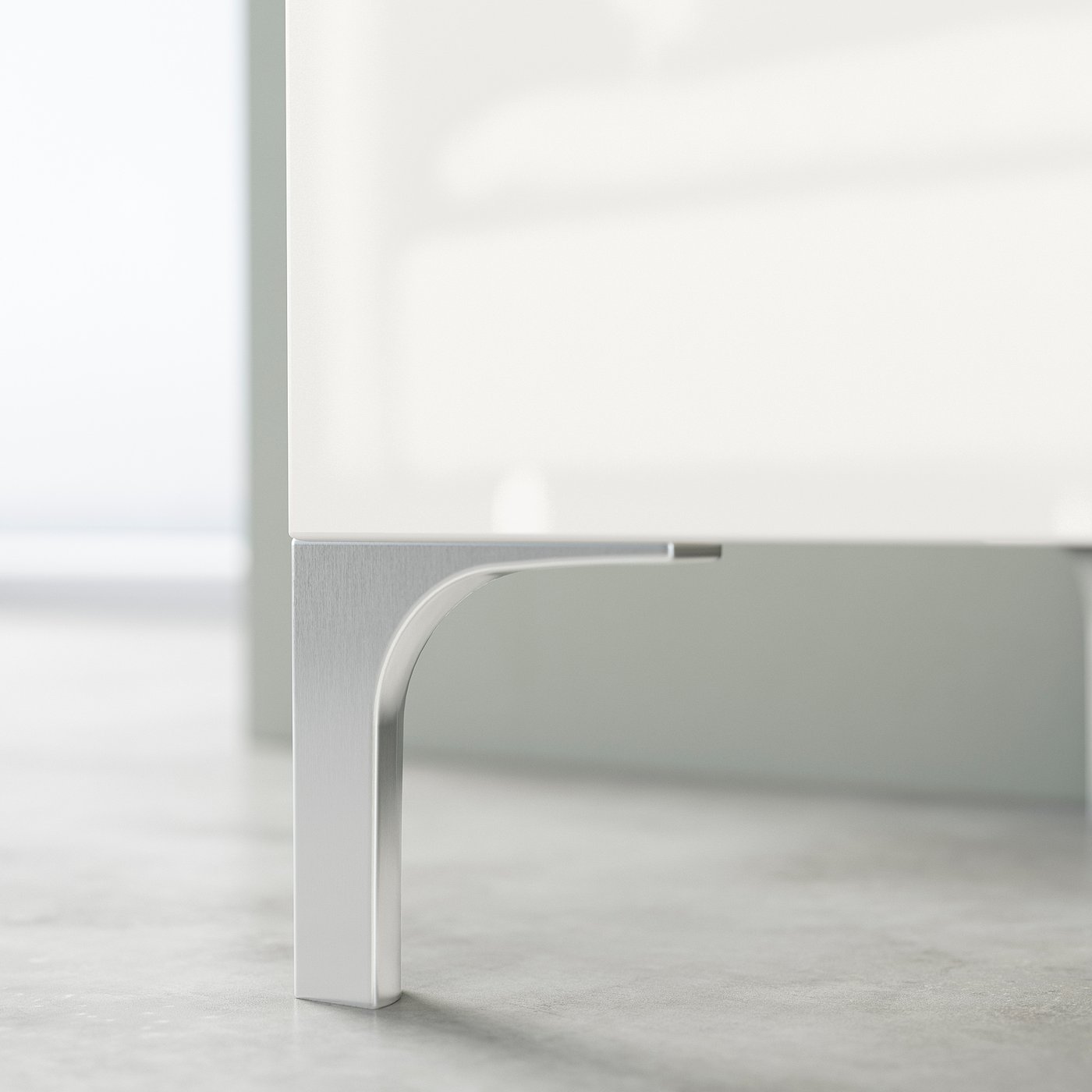White BESTÅ tv stand with silver metal legs, showing minimalist design and cable management feature.