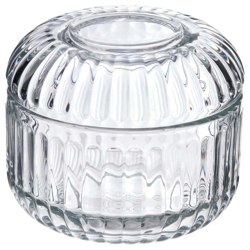 Clear glass container with ridged design for bathroom storage.