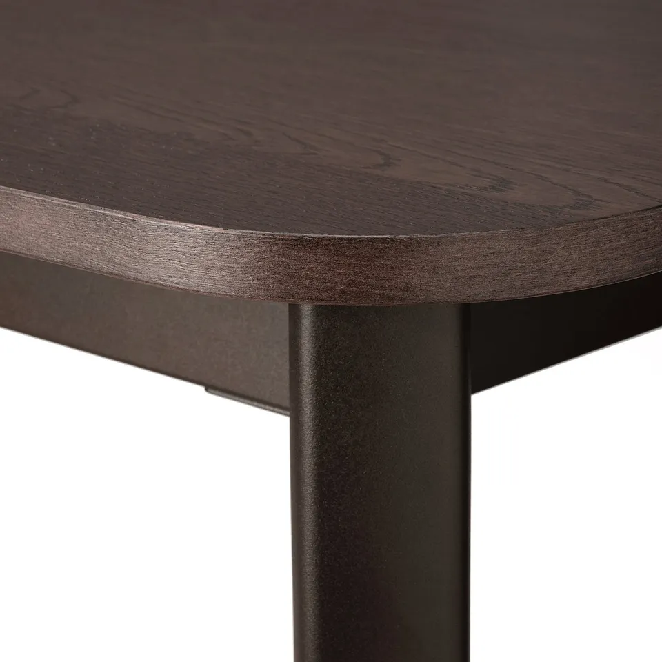 Close-up of modern tables dark wood edge and black metal leg, showcasing elegant design and high-quality materials.
