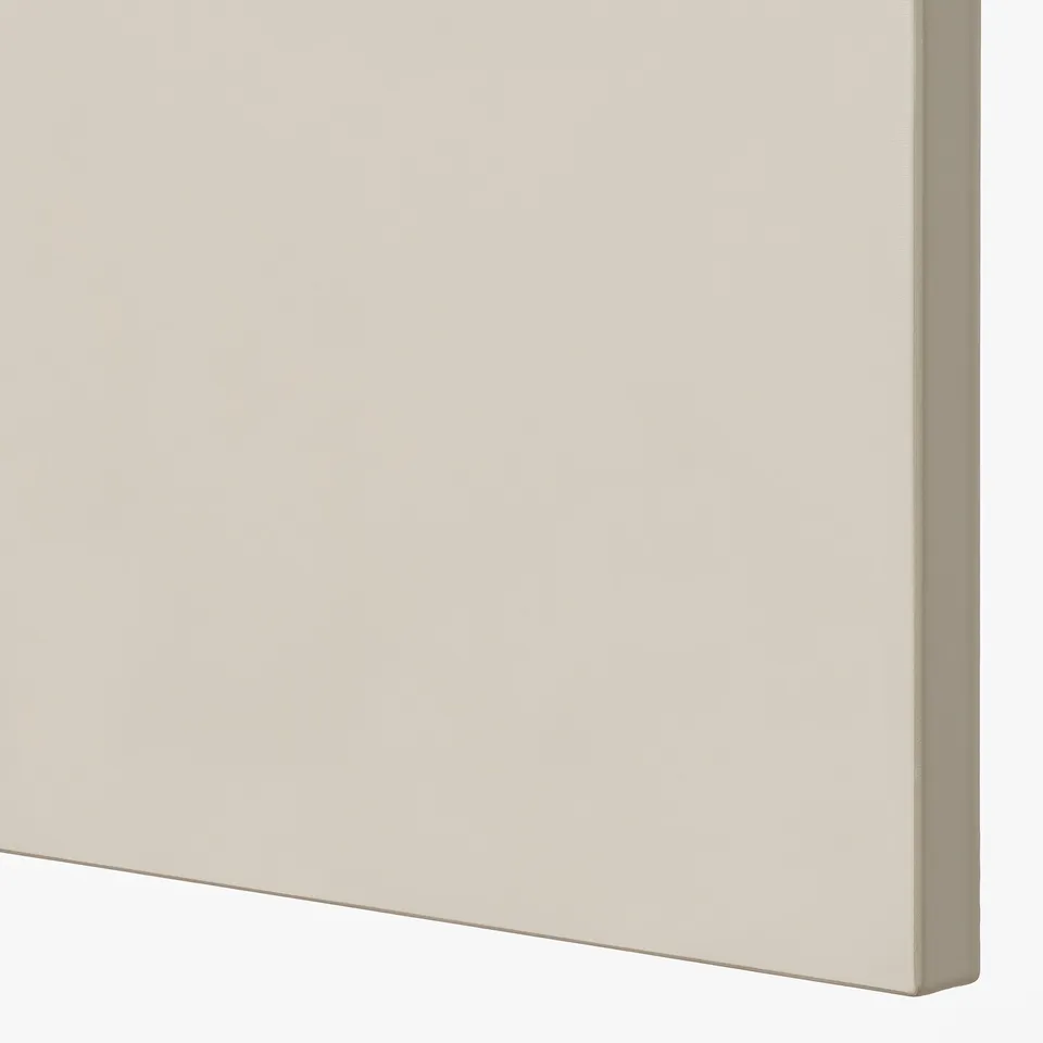 Close-up shows smooth, beige kitchen cabinet door, clean edges, high-quality finish.