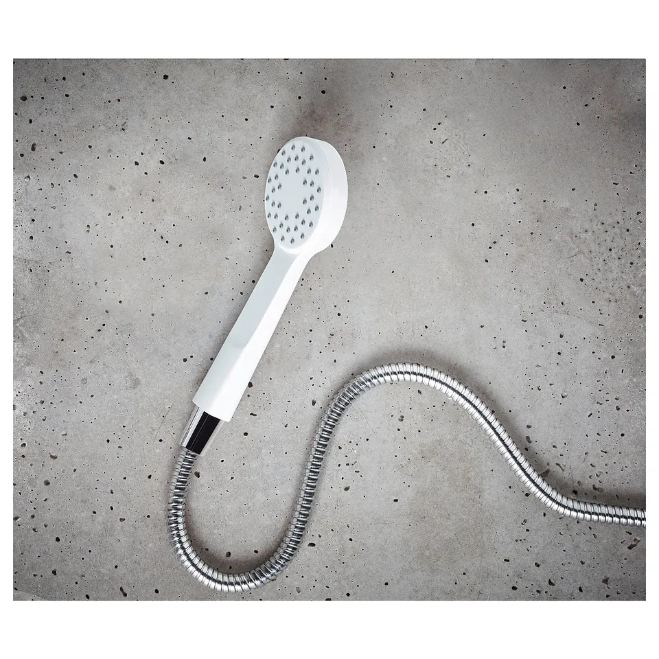 White handheld shower with hose, full spray