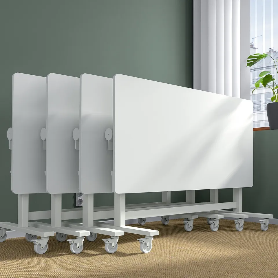 Foldable white conference table on wheels, ideal for flexible meeting spaces.