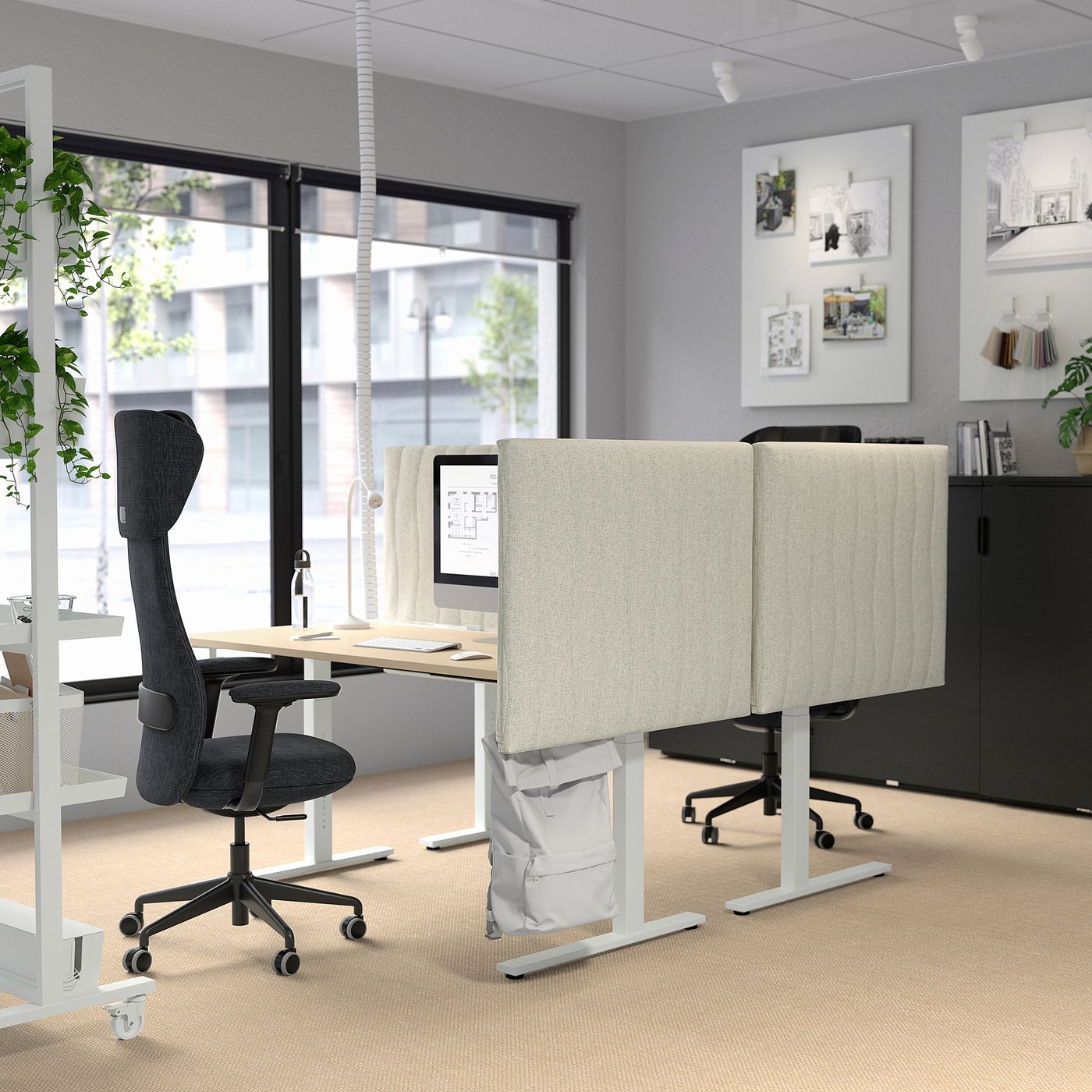 Modern office with MITTZON dual-motor desks, chairs, plants, large window, grey walls. Adjustable.
