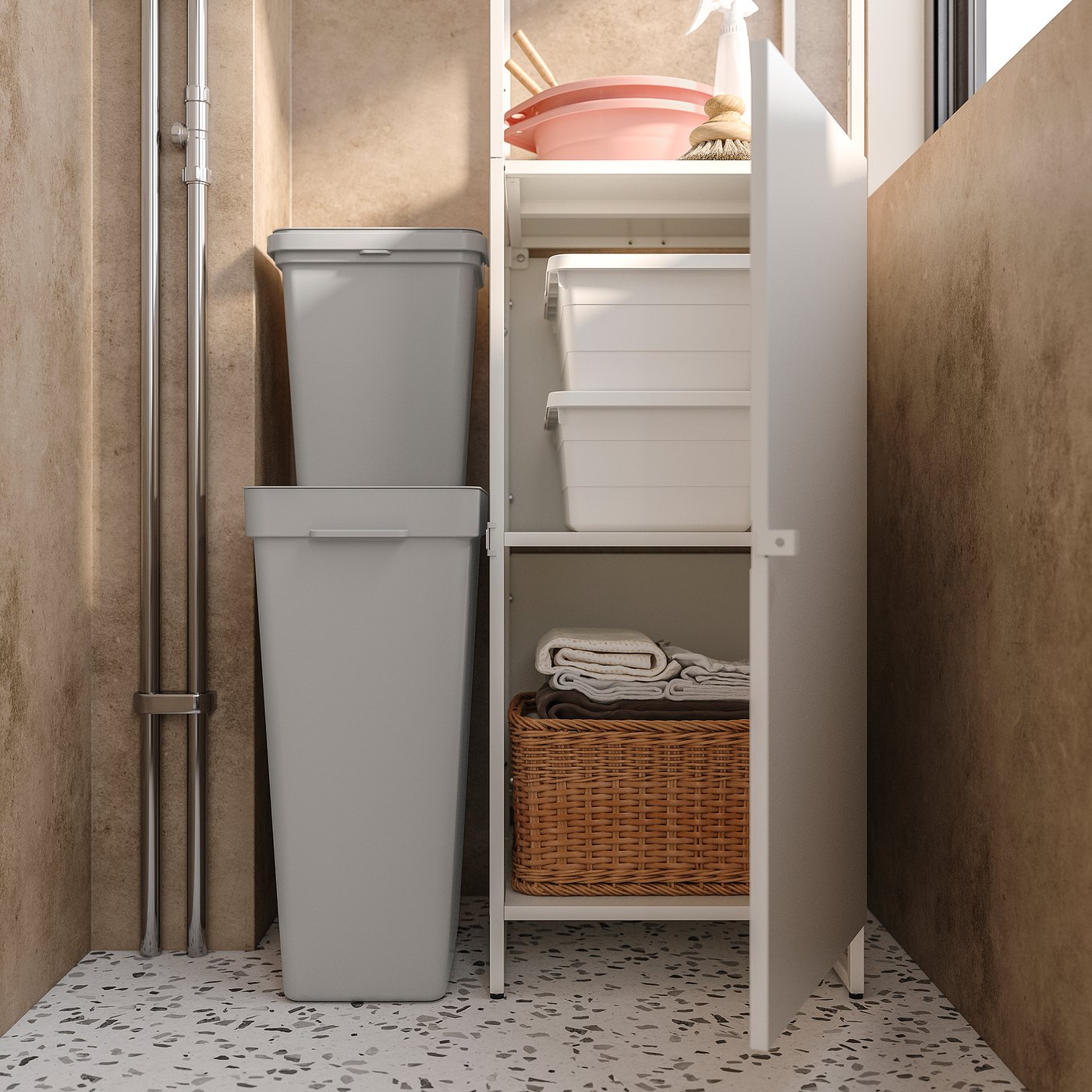 A JOSTEIN storage system with a grey plastic bin and white shelves, featuring a wicker basket and folded linens.