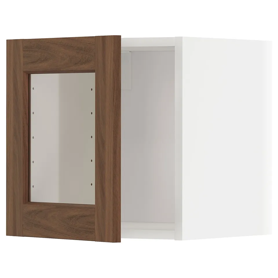 A METOD kitchen cabinet with walnut woodgrain glass doors and white interior, offering a modern and warm design.