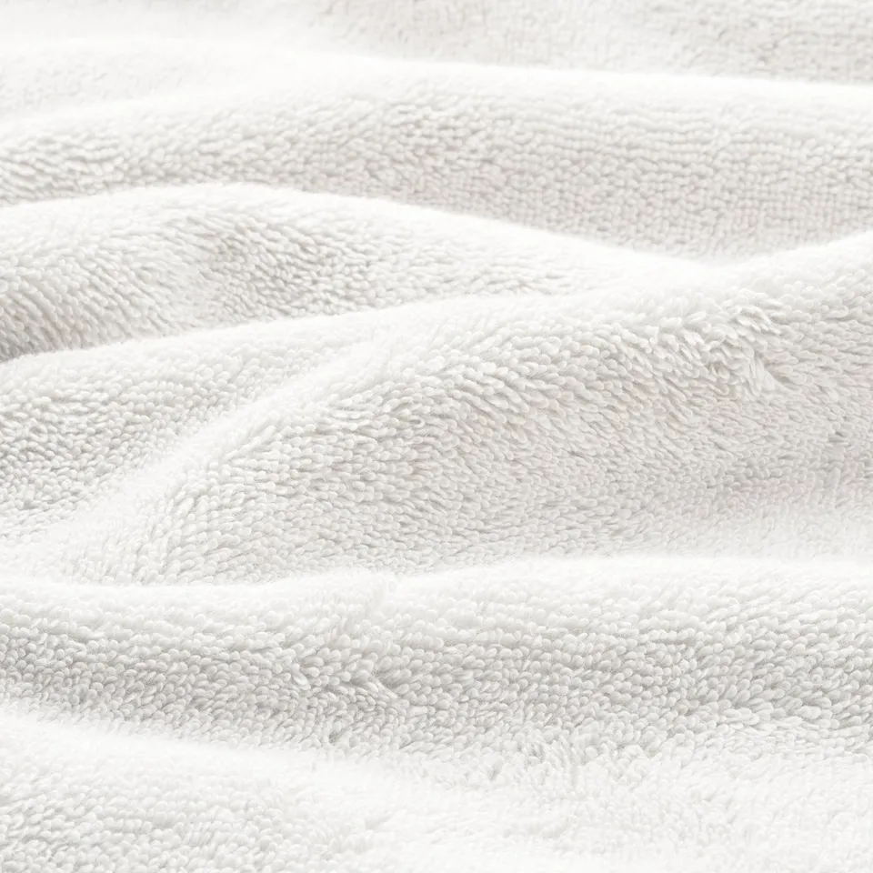 Close-up of soft, plush towels with textured weave, showcasing high quality and absorbency.