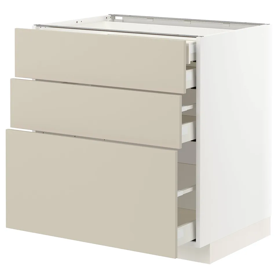White METOD kitchen unit with beige drawers, sleek modern design, three drawers.