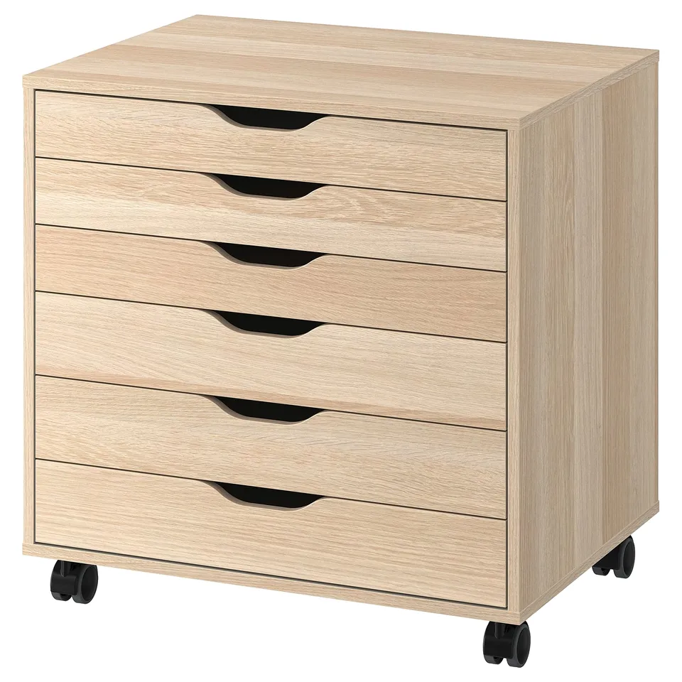 Six-drawer light oak chest with black handles and wheels for easy movement.