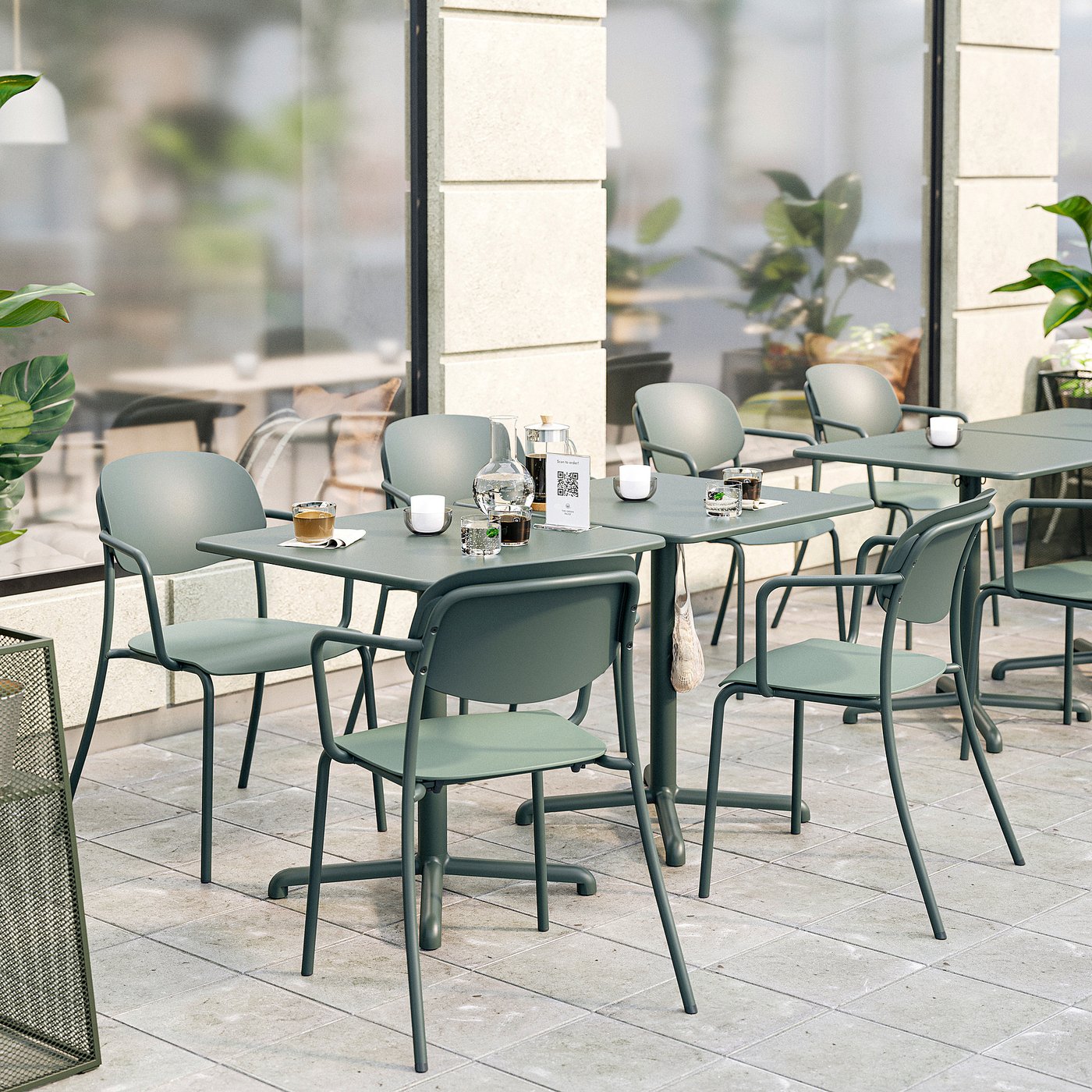 Modern outdoor seating with VISINGSÖ green metal & plastic chairs on patio.