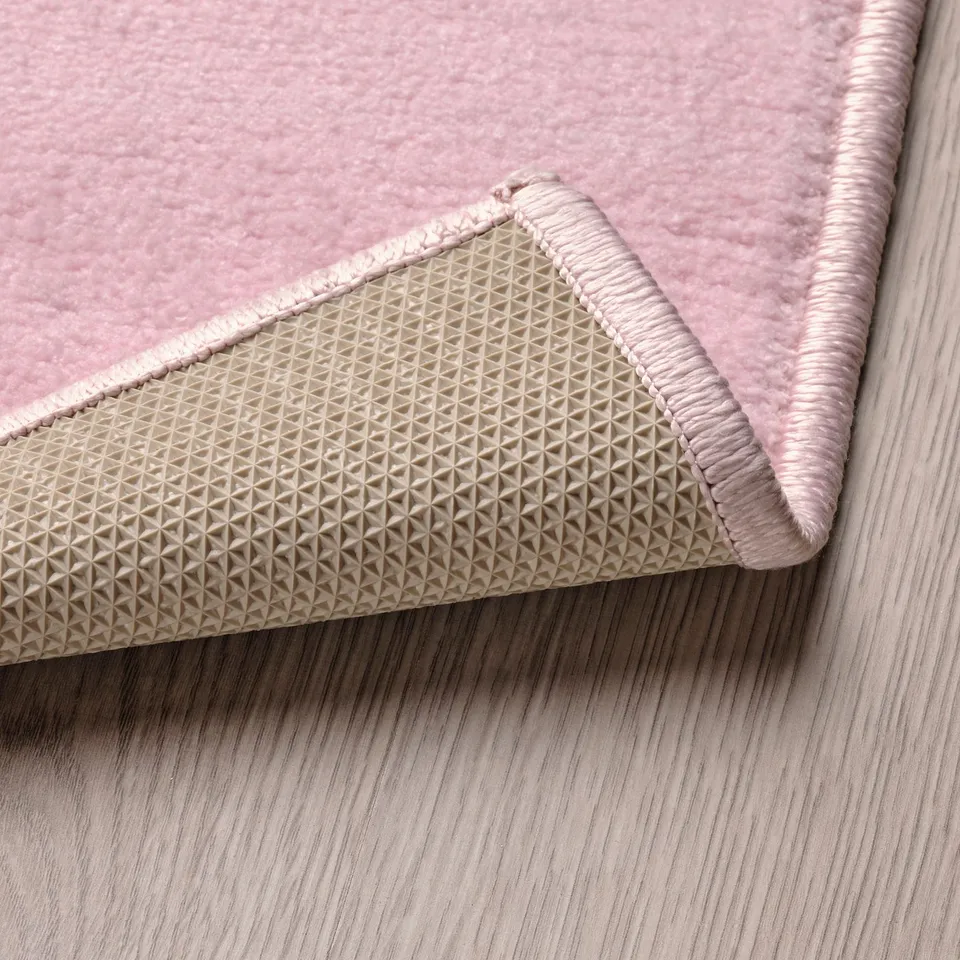 Rug with non-slip back for childs safety and soft, plush surface.