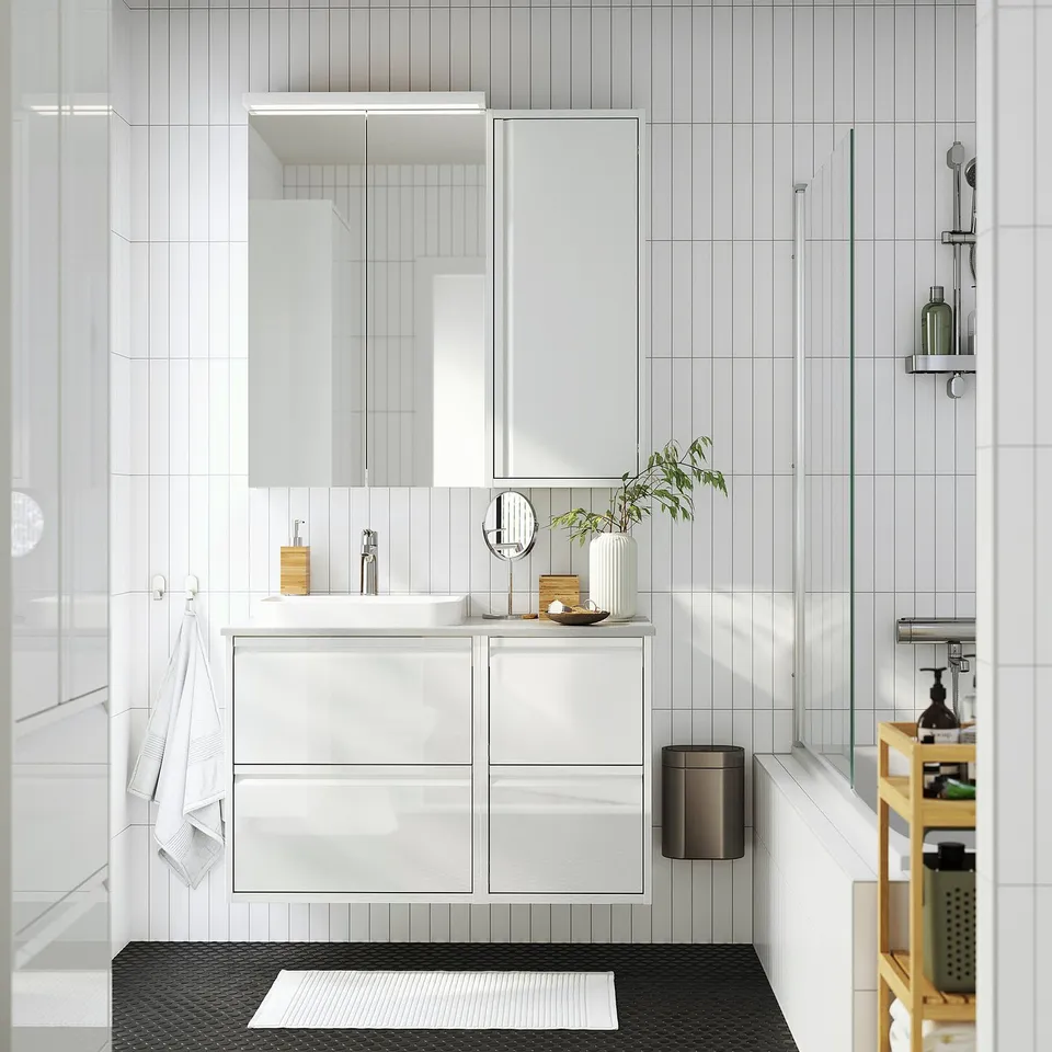 Modern white bathroom with ÄNGSJÖN wall cabinet, high gloss, minimalist style.