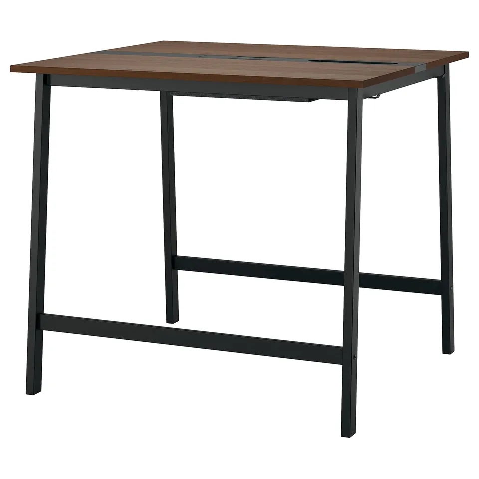 A MITTZON high conference table with a dark wooden top and black metal legs, designed for both sitting and standing with built-in cable management.