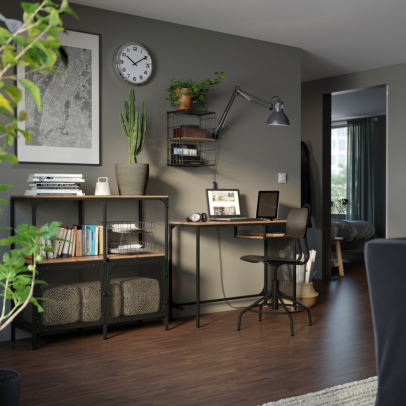Modern home office with dark walls, wooden floors, & FJÄLLBO shelving. Desk, chair, books, plants, decor.
