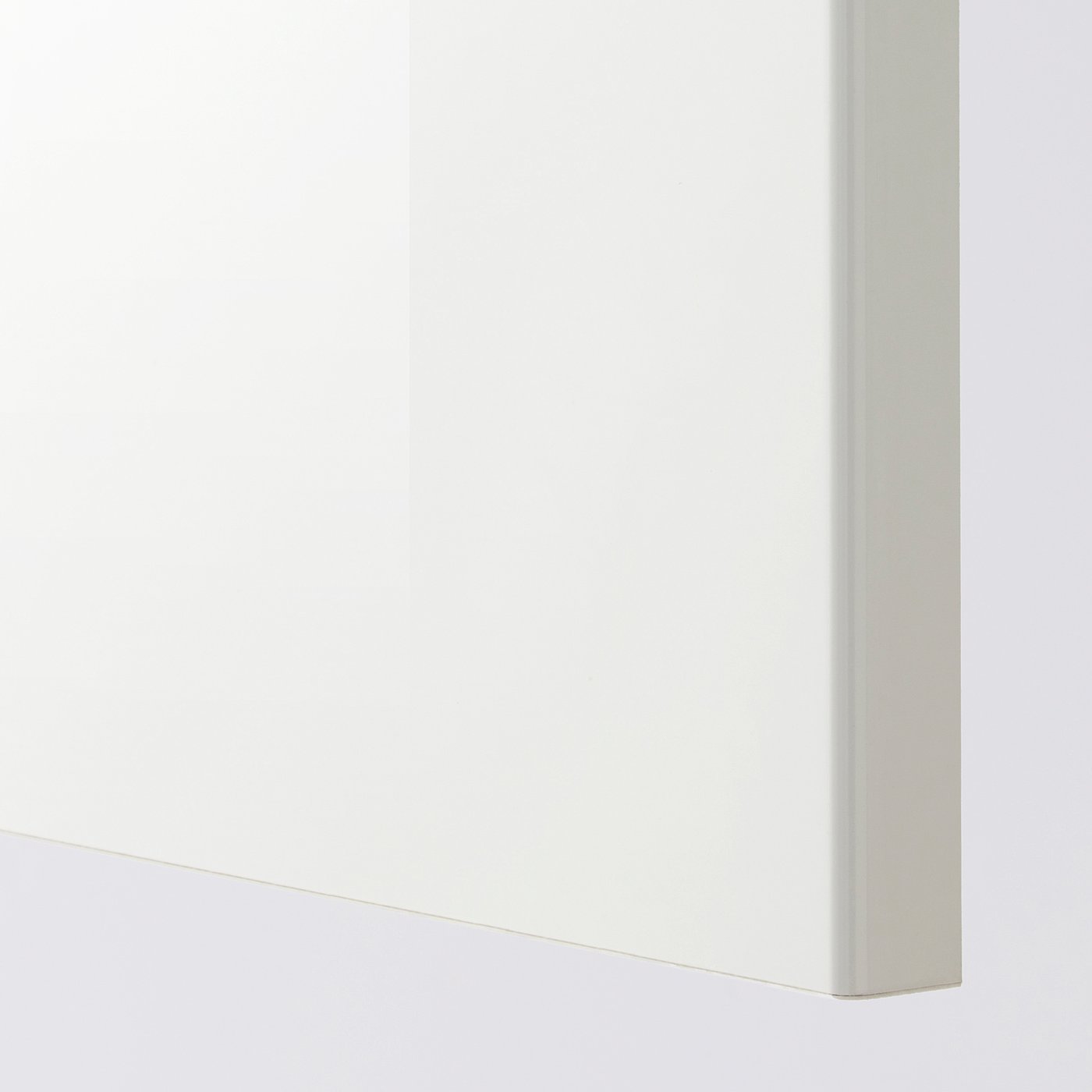 Clean, well-made white cabinet corner. Smooth surfaces, high-quality finish visible.
