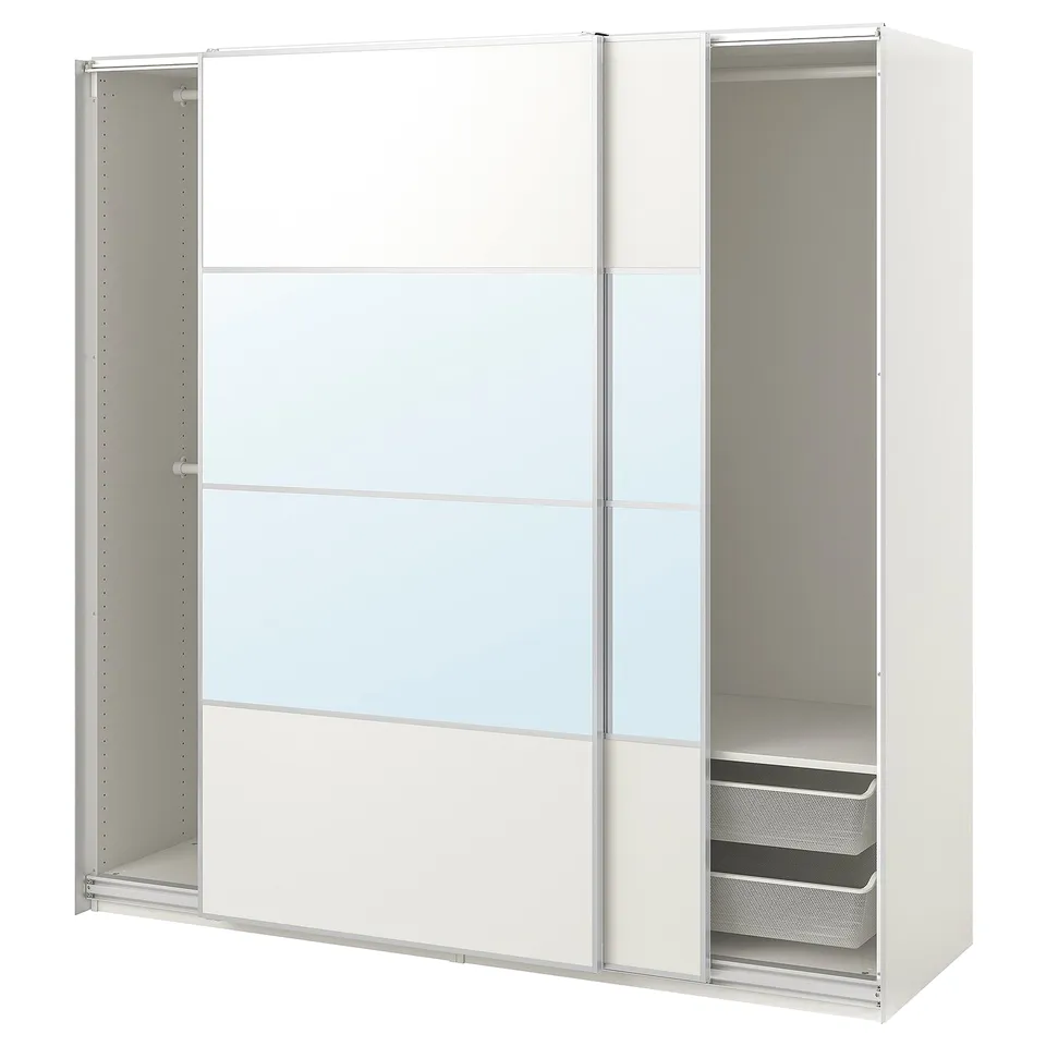 A white PAX wardrobe with sliding glass doors and mesh baskets. The modern design adjustable feet and minimalist, handle-less doors.