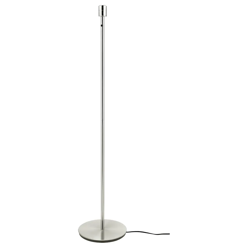 SKAFTET floor lamp, sleek silver, modern design, tall steel base, round white base, simple stylish.