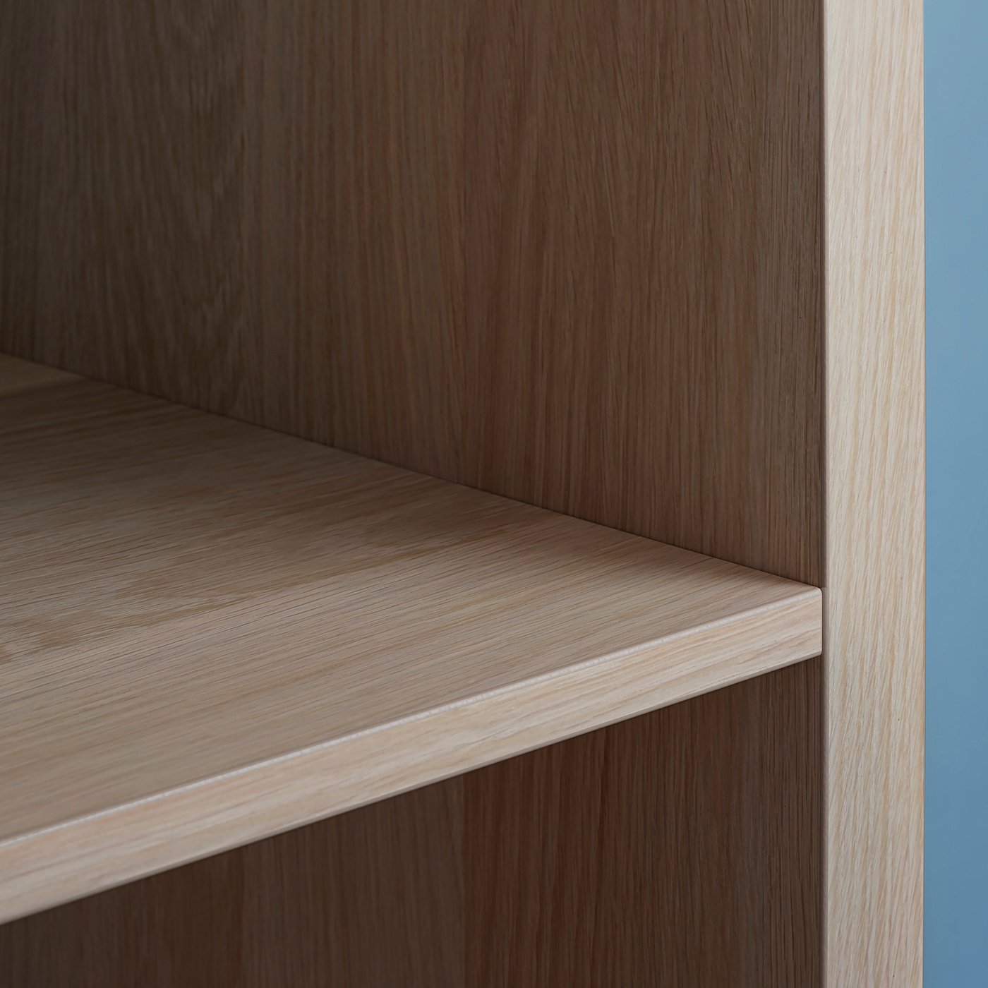 KALLAX light brown wooden shelf close-up, sleek design, visible grain and edge detail.