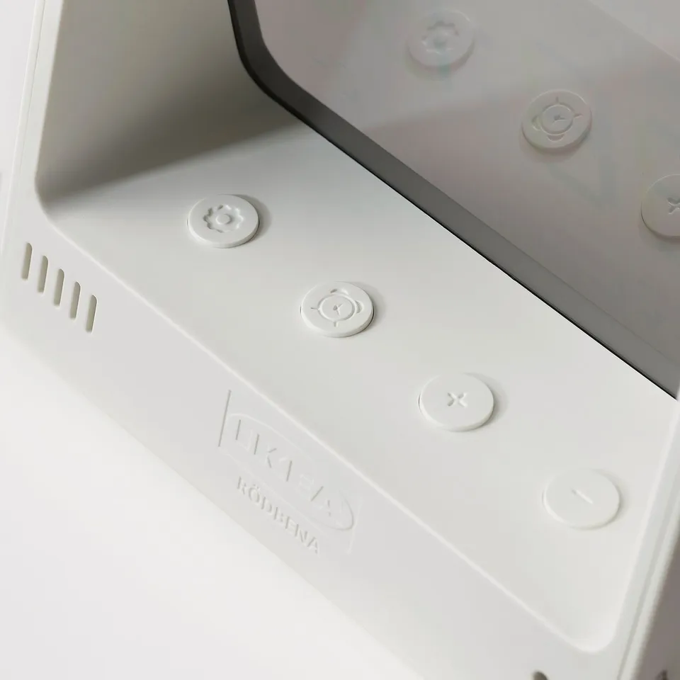 White modern alarm clock with clear buttons; brand röbena, quality design.