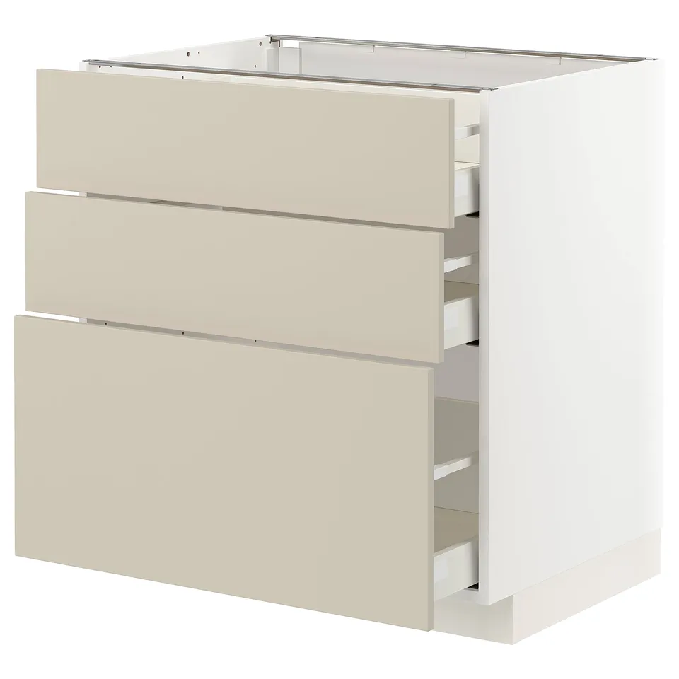 A beige METOD kitchen cabinet with three full-extension drawers.