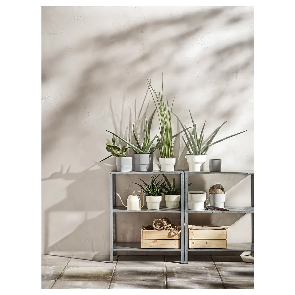 HYLLIS metal shelving unit with potted plants, modern minimalist design.