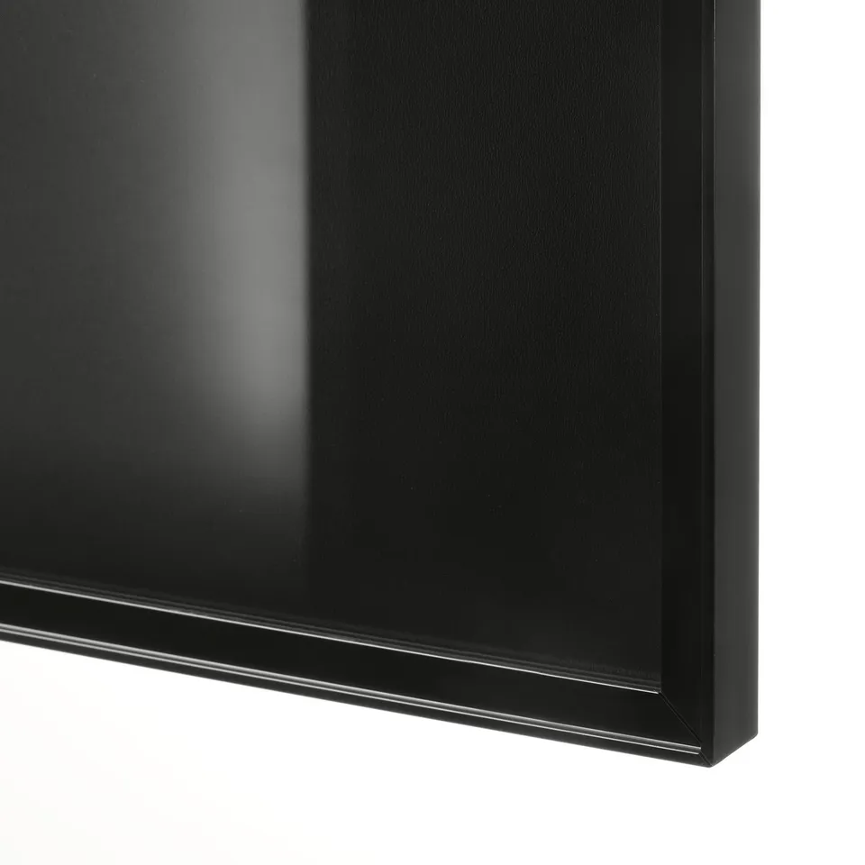 Close-up of sleek, black BILLY bookcase corner. Smooth finish, sturdy build.
