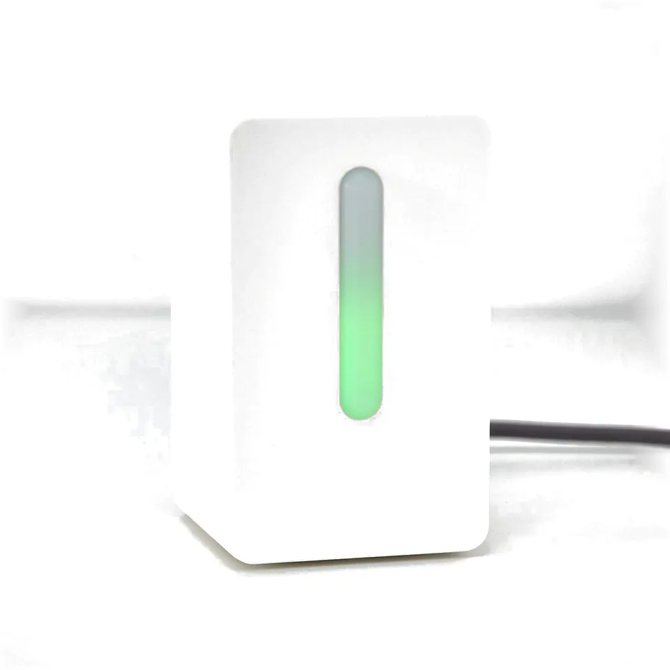 White FÖRNUFTIG air purifier with green indicator light, showing its on and working.
