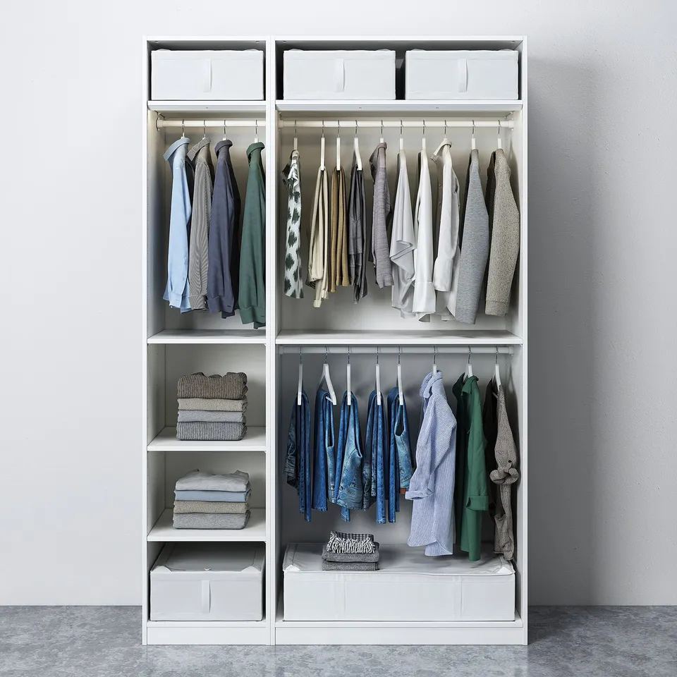 Modern white wardrobe with clothing hangers, folded clothes, and storage bins, designed for organised space.