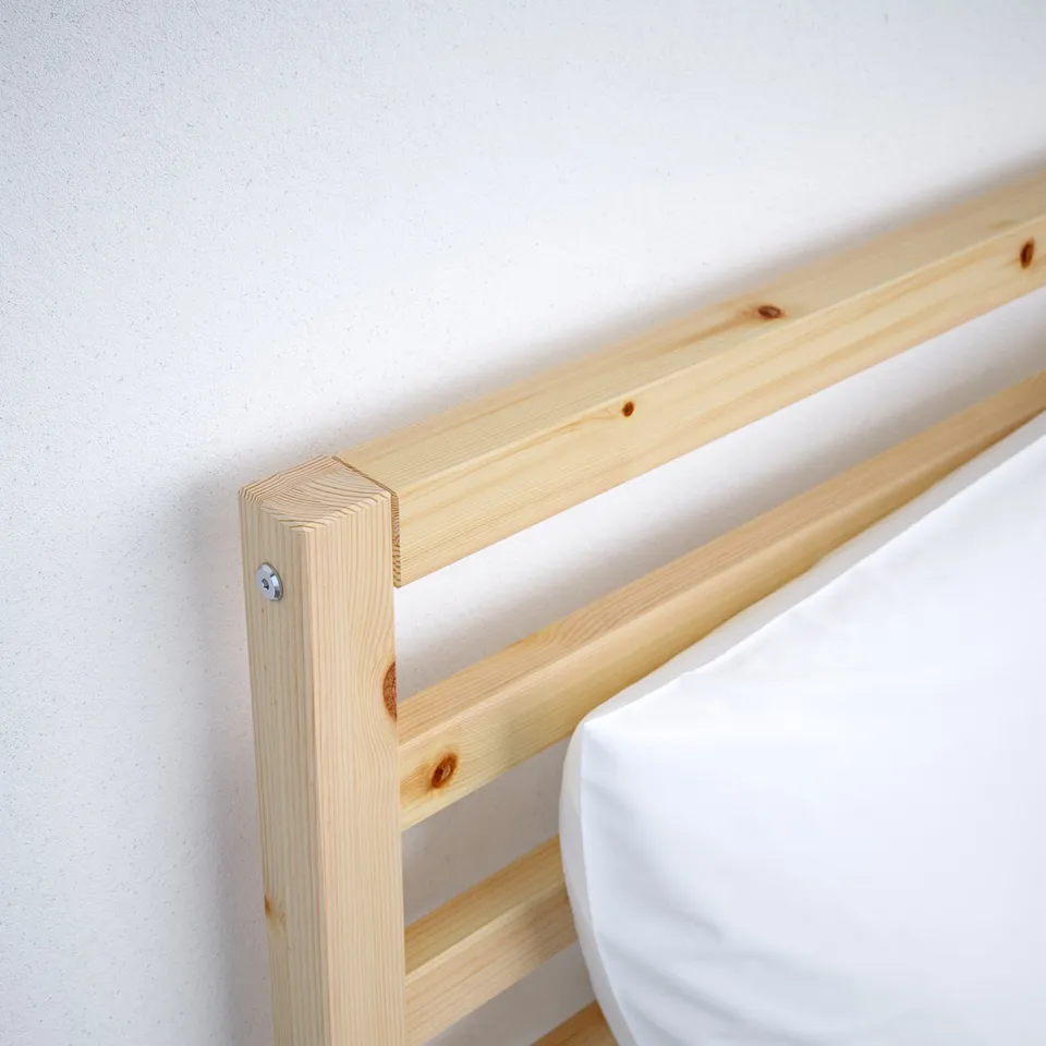 Pine wood bed frame corner, natural finish