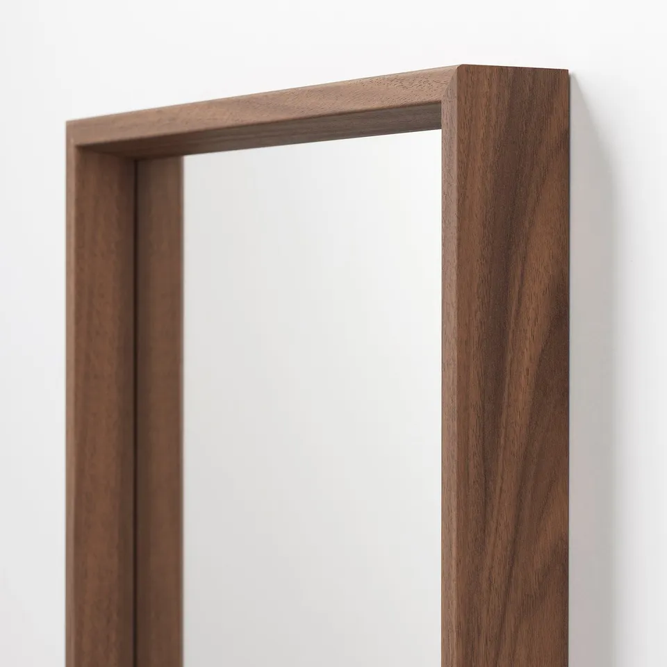 Walnut-finished wooden frame, rectangular mirror edge, smooth texture, sturdy construction.