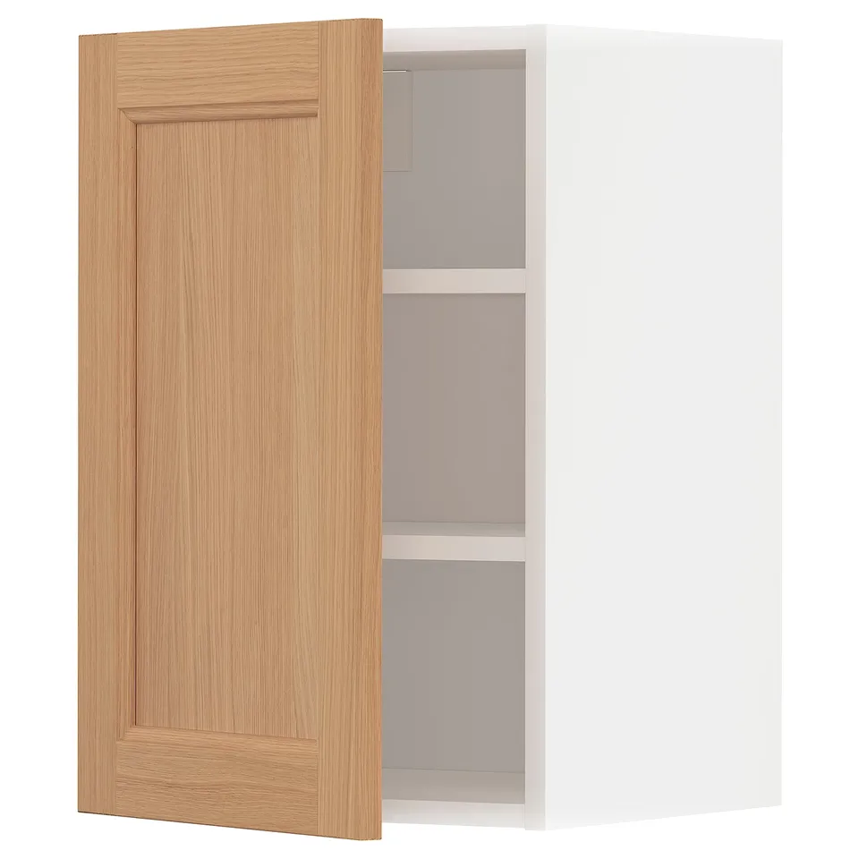 An open light oak-colored kitchen cabinet with a white interior and shelf.