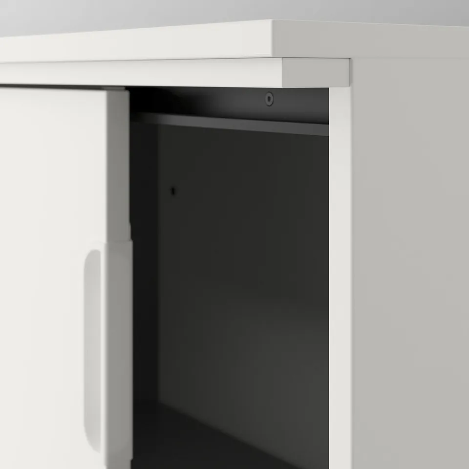 Modern office cabinet with sleek white finish and dark interior, featuring sliding doors and clean lines.