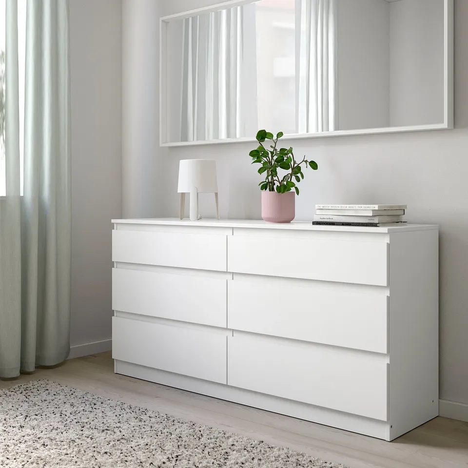 KULLEN chest with mirror, lamp, plant, books.