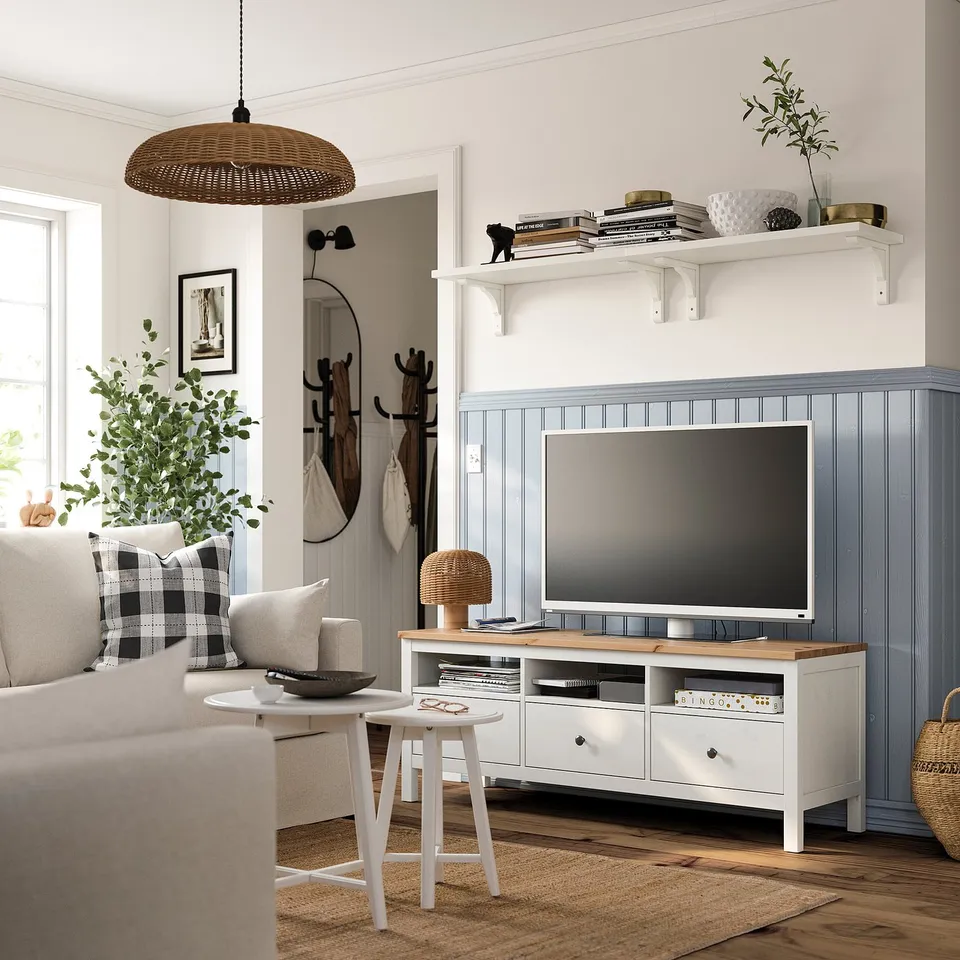 Modern living room with white HEMNES tv bench, grey sofa, and side table.