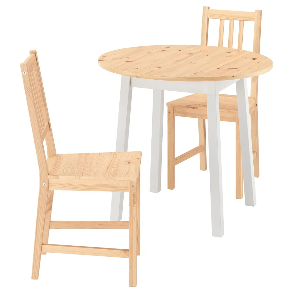 Light wood dining set: round table & 2 chairs, simple, space-saving.